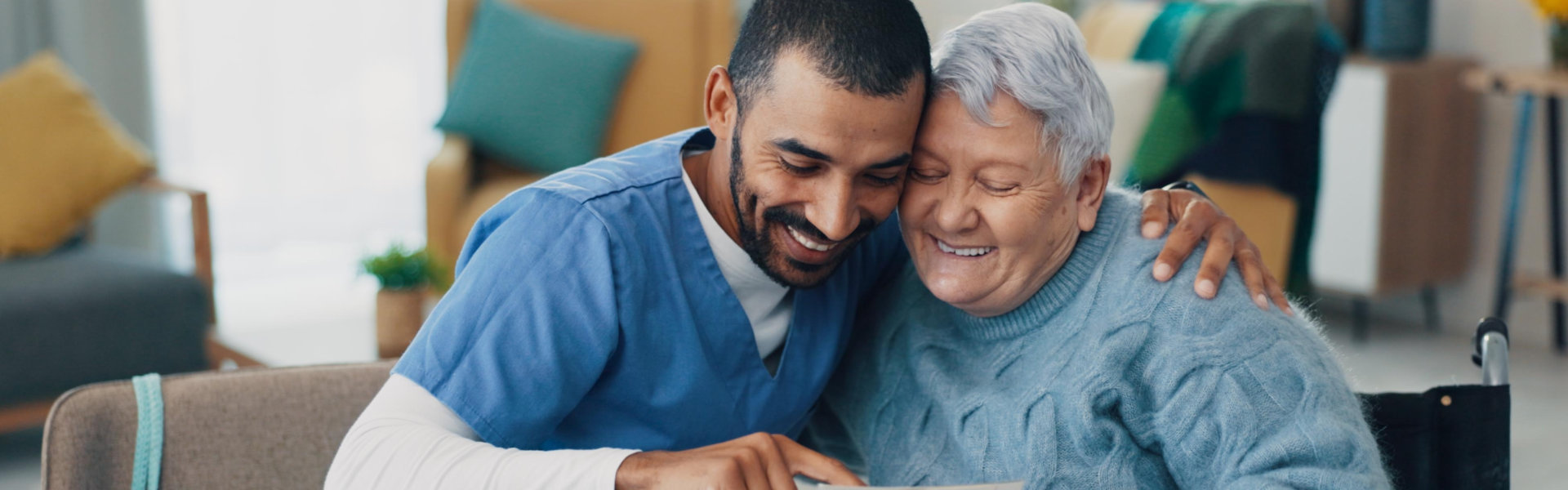 caregiver and elderly smiling
